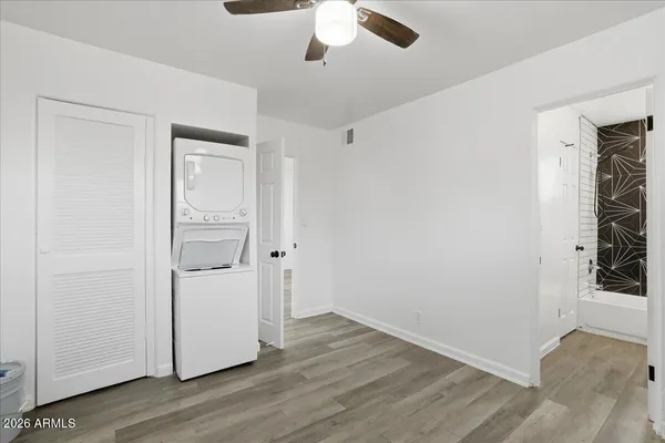 a view of room with wooden floor and window