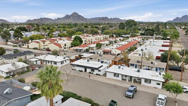 an aerial view of residential houses with outdoor space