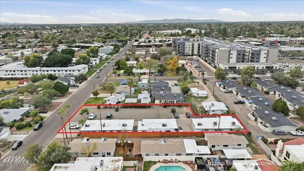 an aerial view of residential houses with outdoor space