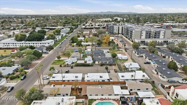 an aerial view of residential houses with outdoor space