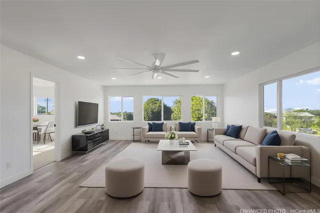 a living room with furniture and a large window