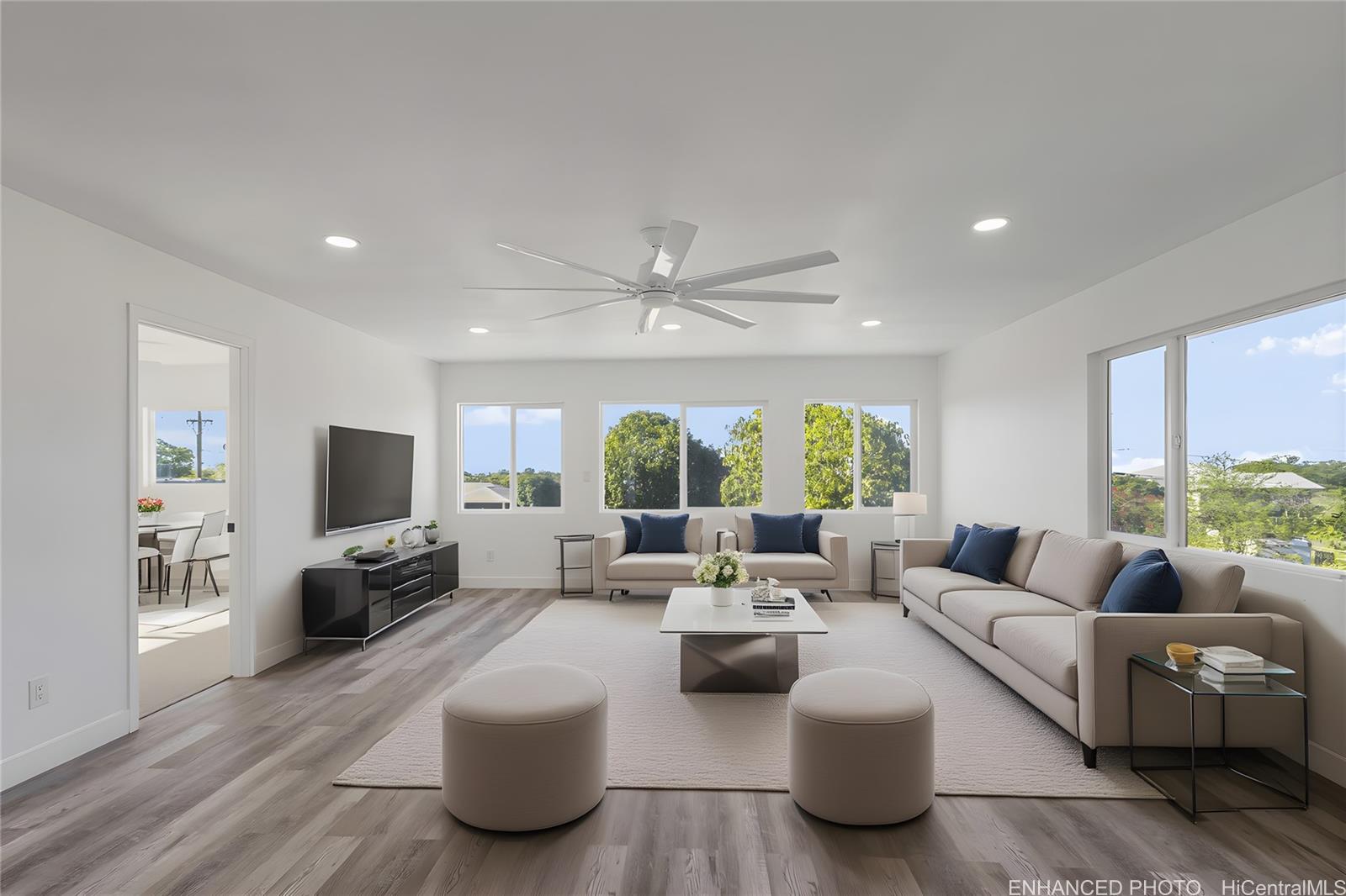 84-1036 Noholio Road Waianae, HI 96792 - Photo 11 of 25 Enhanced photo of upstairs living room staged with virtual furniture. Peek-a-boo ocean views from these windows.
