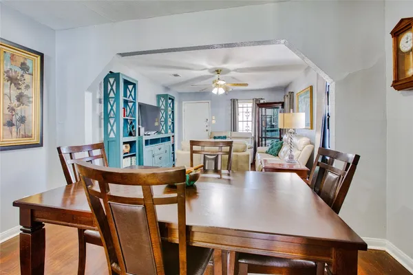 a view of a dining room with furniture and a bookshelf