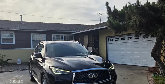 a car parked in front of a house