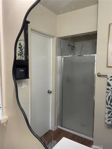 a bathroom with a shower and a sink