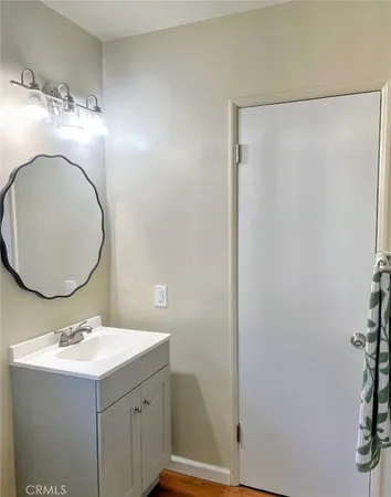 a bathroom with a sink and mirror