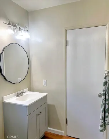a bathroom with a sink and mirror