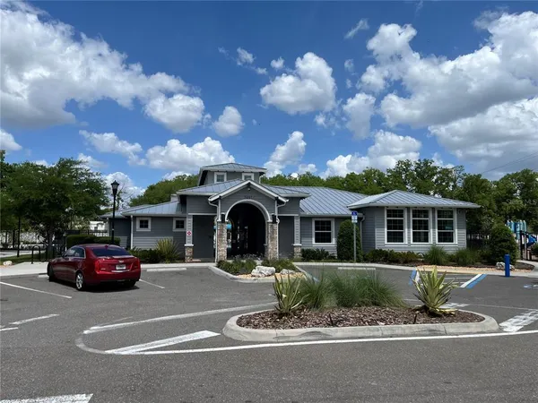 an aerial view of residential house with outdoor space and parking