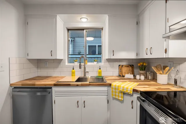 a kitchen with a sink and cabinets