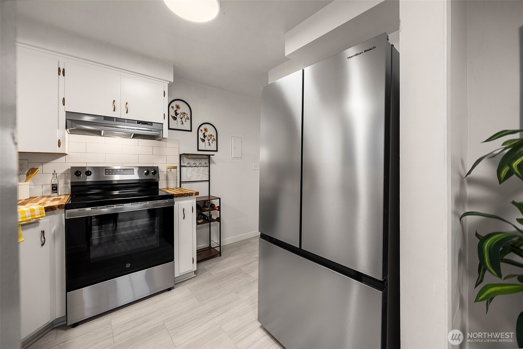 2108 Summit Avenue, Unit 3 Everett, WA 98201 - Photo 15 of 28 a kitchen with stainless steel appliances granite countertop a refrigerator and a stove top oven