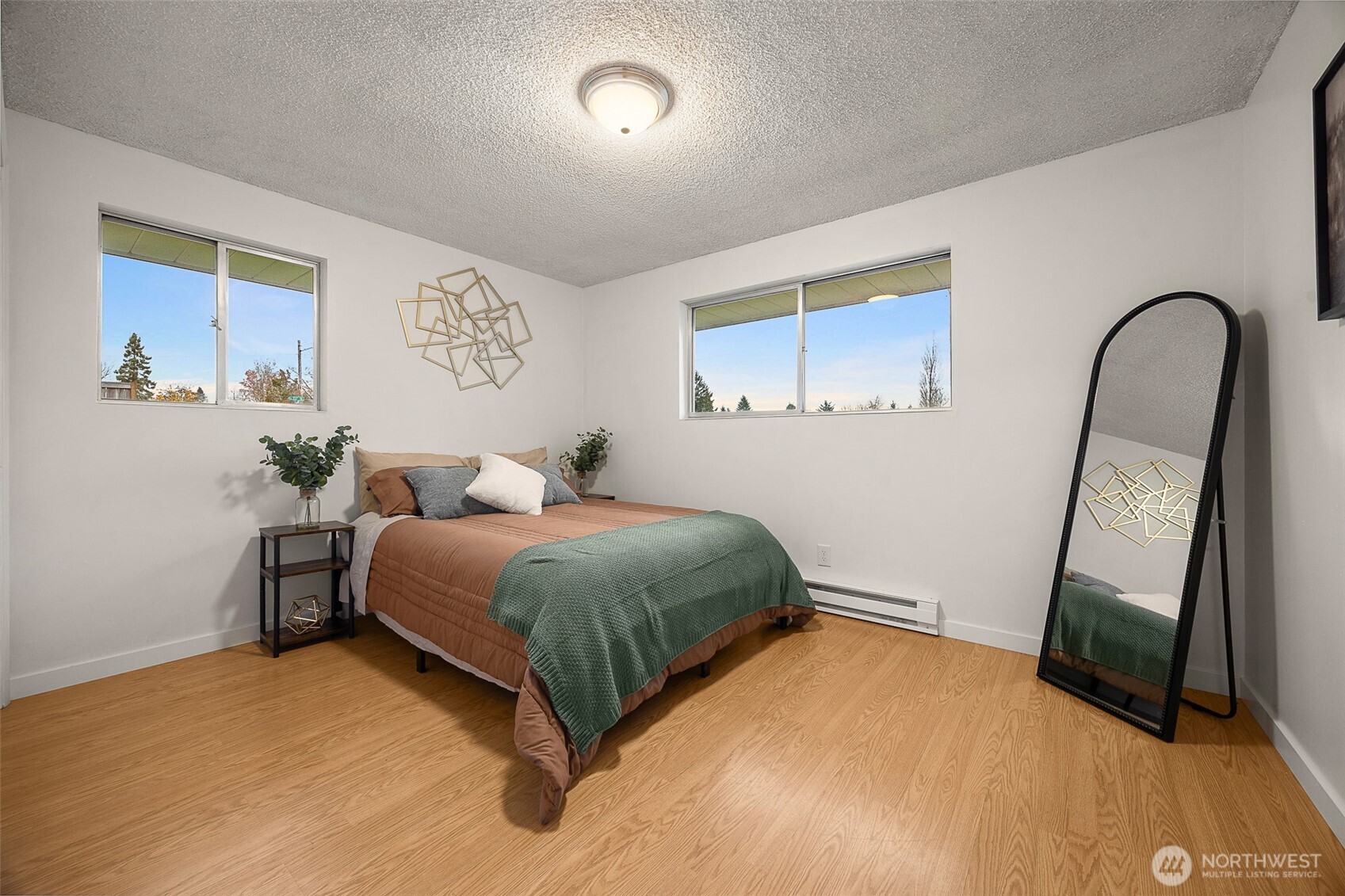 2108 Summit Avenue, Unit 3 Everett, WA 98201 - Photo 16 of 28 a bedroom with a bed and a mirror