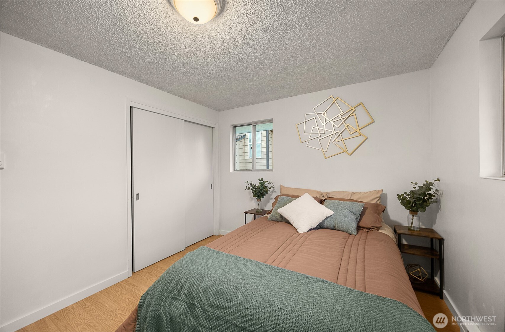 2108 Summit Avenue, Unit 3 Everett, WA 98201 - Photo 17 of 28 a bedroom with a bed and painting on the wall