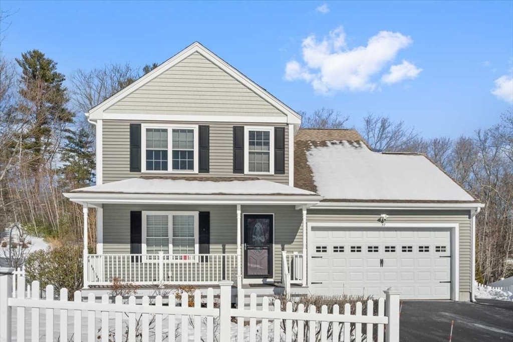 57 Partridge Hill Road Sutton, MA 01590 - Photo 1 of 40 a view of a white house with large windows