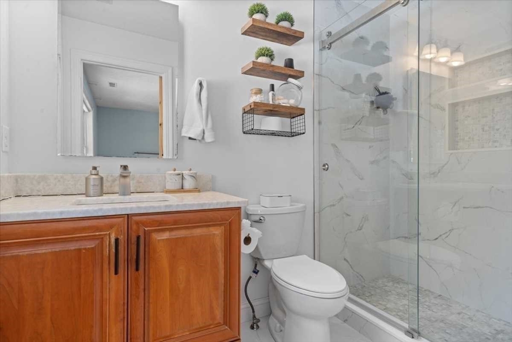 57 Partridge Hill Road Sutton, MA 01590 - Photo 18 of 40 a bathroom with a granite countertop sink toilet and shower