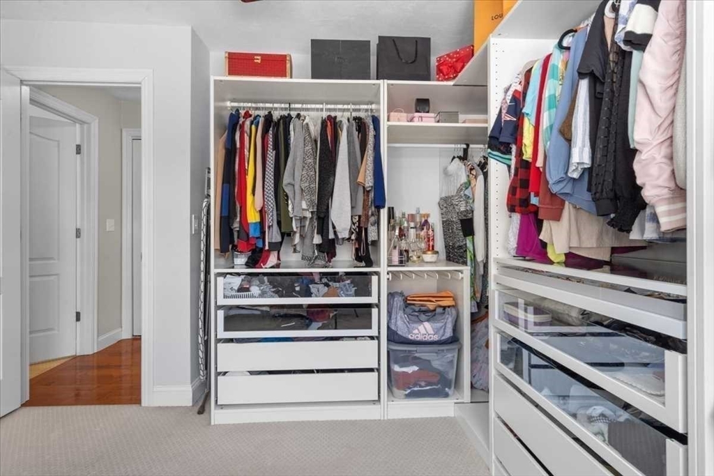 57 Partridge Hill Road Sutton, MA 01590 - Photo 20 of 40 a view of walk in closet with clothes and shoes
