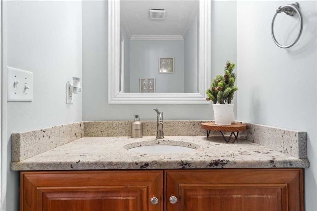 57 Partridge Hill Road Sutton, MA 01590 - Photo 25 of 40 a bathroom with a granite countertop sink and a mirror