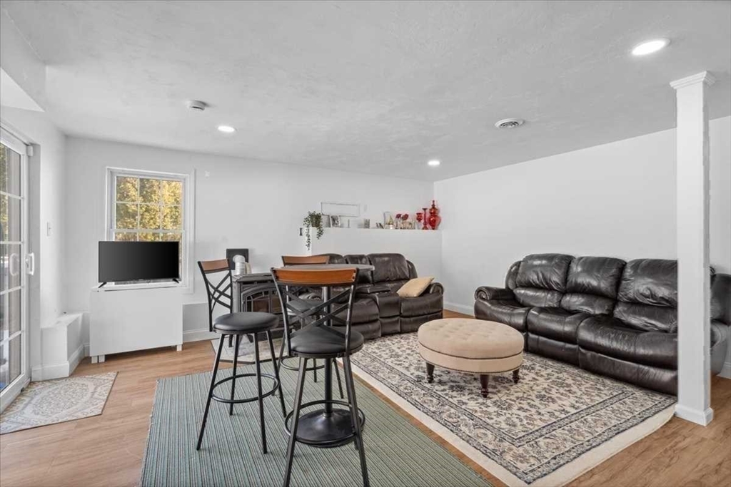 57 Partridge Hill Road Sutton, MA 01590 - Photo 26 of 40 a living room with furniture and a rug