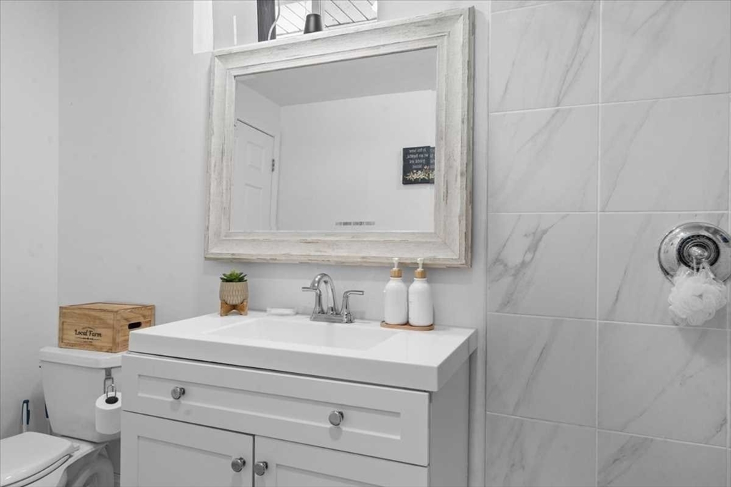57 Partridge Hill Road Sutton, MA 01590 - Photo 29 of 40 a bathroom with a sink and a toilet