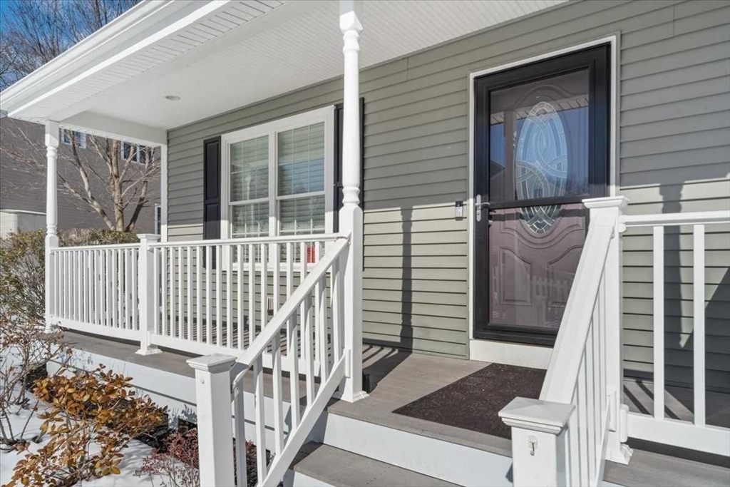 57 Partridge Hill Road Sutton, MA 01590 - Photo 3 of 40 a view of a balcony with wooden floor and fence