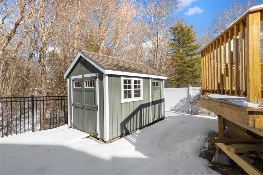 57 Partridge Hill Road Sutton, MA 01590 - Photo 34 of 40 a view of house with a large window and wooden fence