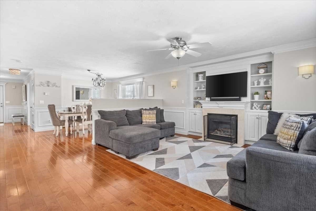 57 Partridge Hill Road Sutton, MA 01590 - Photo 6 of 40 a living room with furniture a fireplace and a flat screen tv