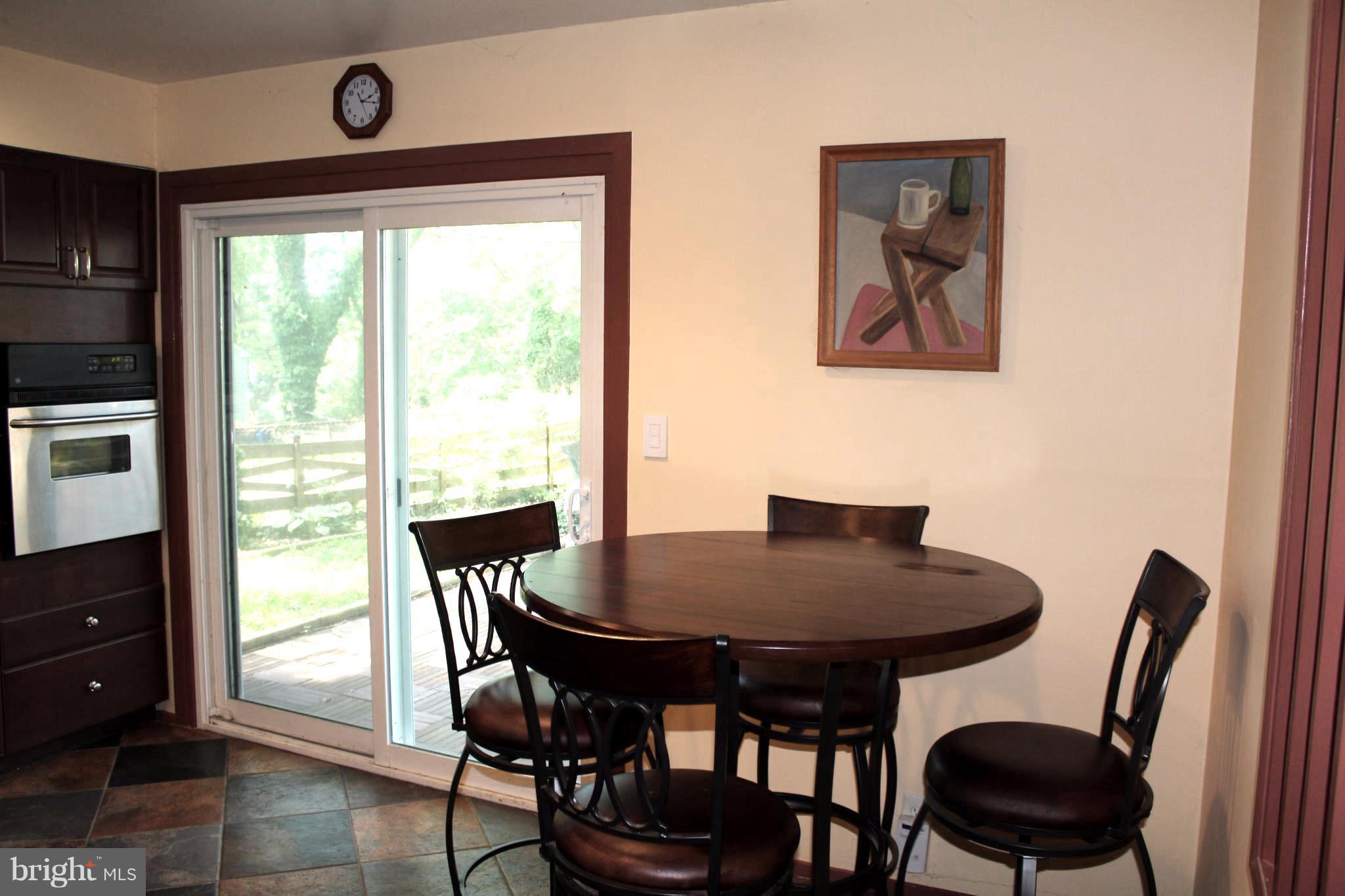 4303 Emden Street Silver Spring, MD 20906 - Photo 12 of 29 eat-in area of kitchen and patio doors to outside