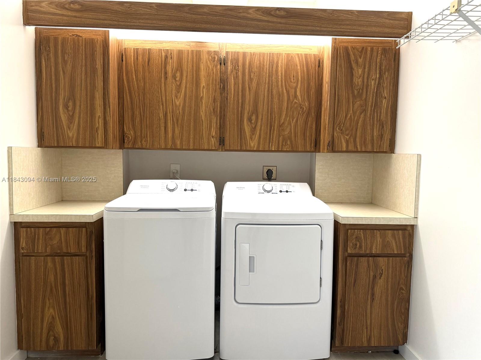 1717 Whitehall Drive, Unit 201 Davie, FL 33324 - Photo 14 of 18 a utility room with dryer and washer