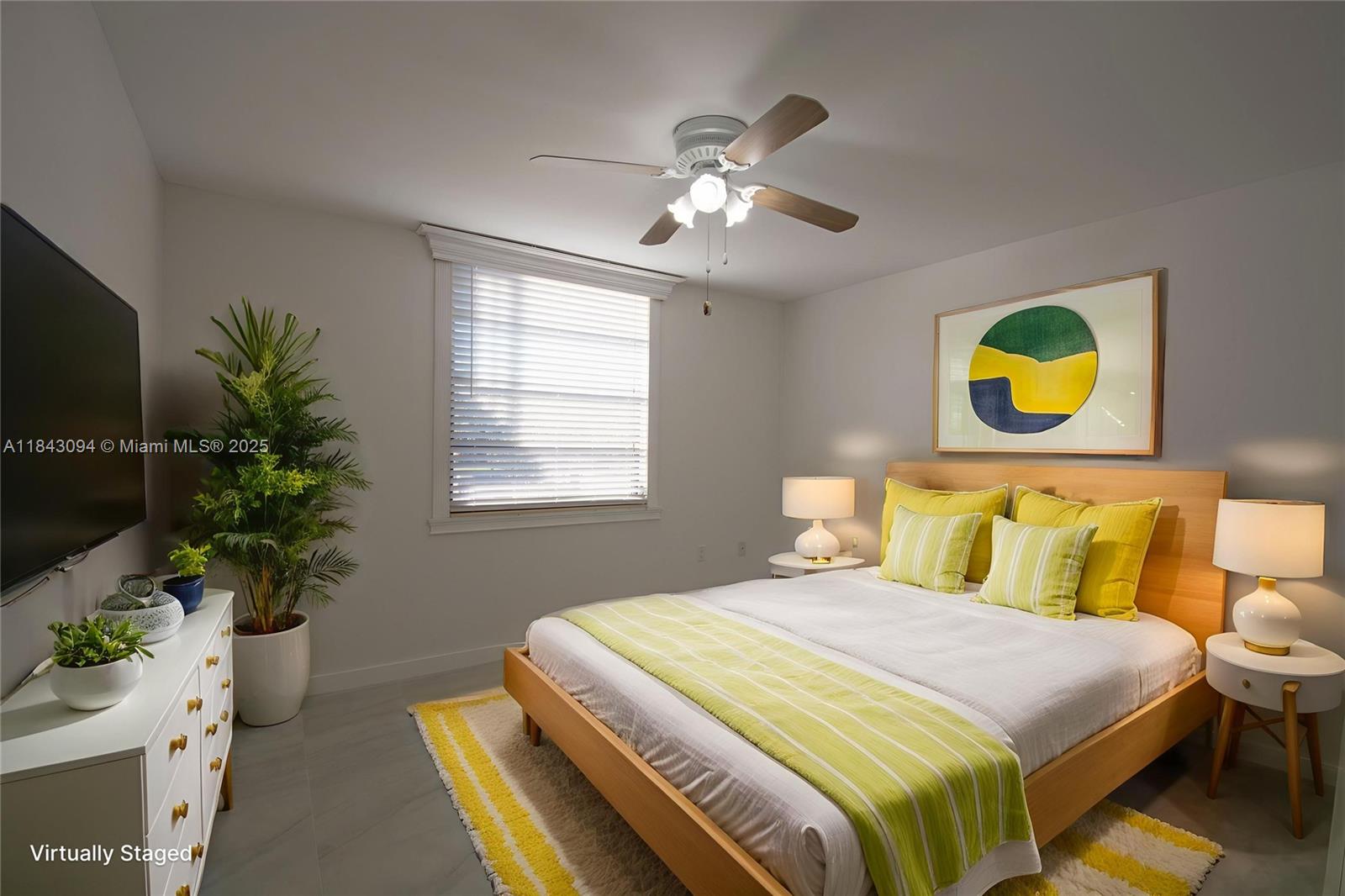 1717 Whitehall Drive, Unit 201 Davie, FL 33324 - Photo 10 of 18 a bedroom with a bed and a potted plant