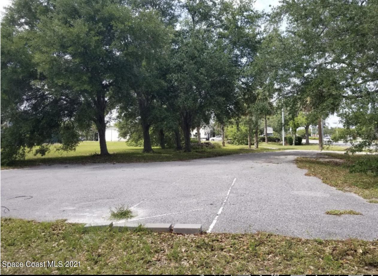 6990 North Wickham Road Melbourne, FL 32940 - Photo 8 of 9 Partially paved driveway