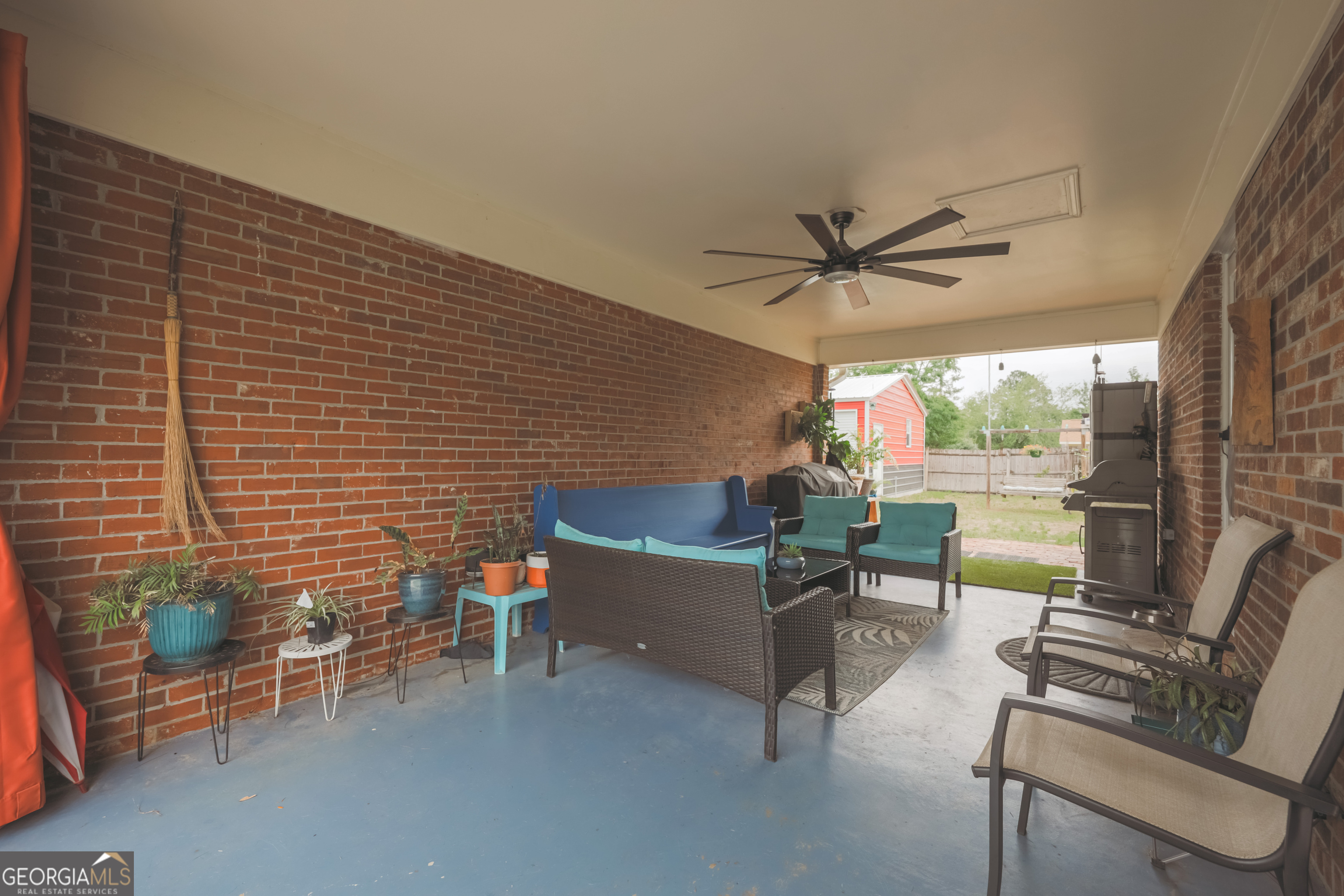 106 Beaver Drive Blackshear, GA 31516 - Photo 3 of 20 wooden floor in a balcony with a potted plant