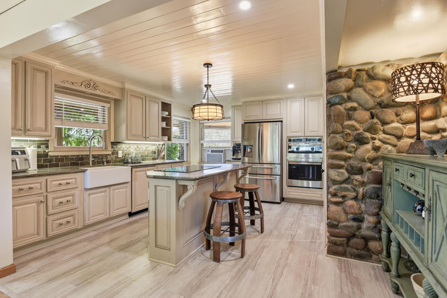 7201 Happy Valley Road Somerset, CA 95684 - Photo 16 of 75 Welcome to an entertainer's dream kitchen. This space has freshly updated appliances an lots of natural light.