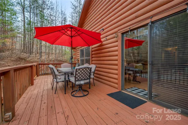 an outdoor view of patio with umbrella