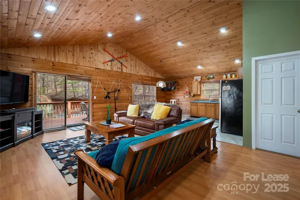 a open kitchen with stainless steel appliances granite countertop a stove and a wooden cabinets