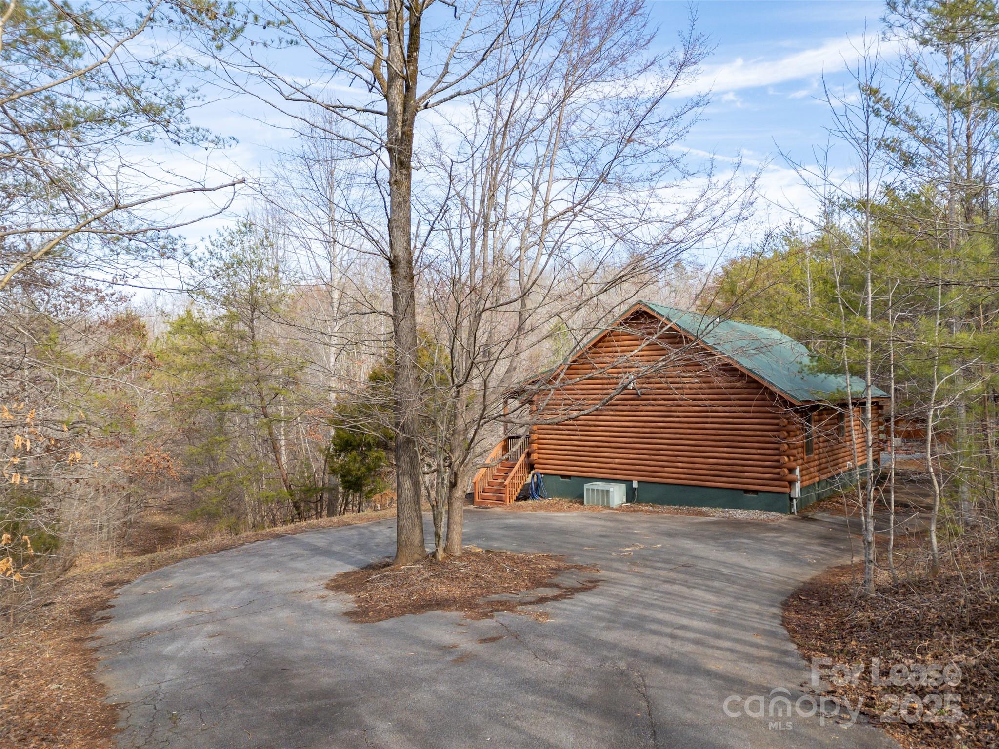 476 Front Ridge Circle Rutherfordton, NC 28139 - Photo 2 of 44 a tree in the middle of a yard