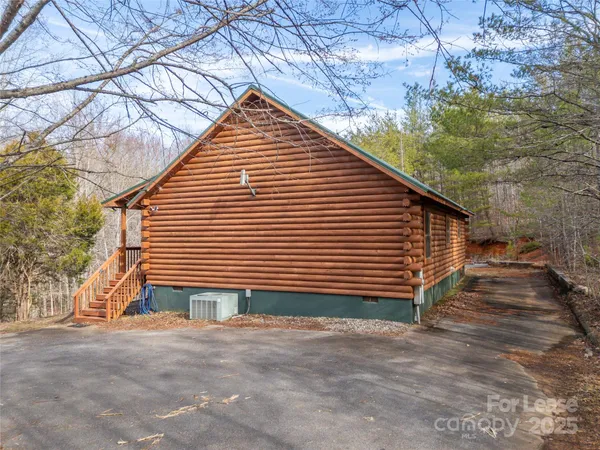 a view of a house with a yard and garage