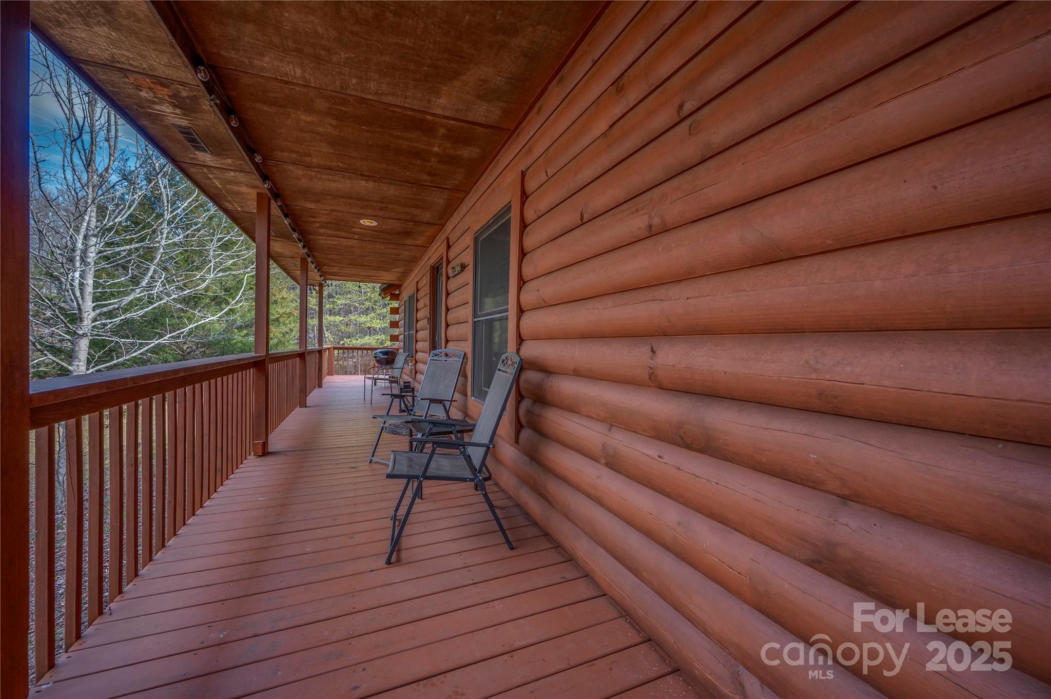 476 Front Ridge Circle Rutherfordton, NC 28139 - Photo 10 of 44 a balcony with chairs and wooden floor