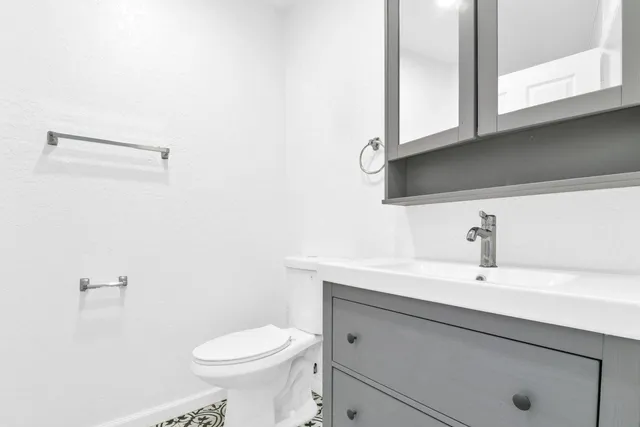 a view of a garden with a building in the background