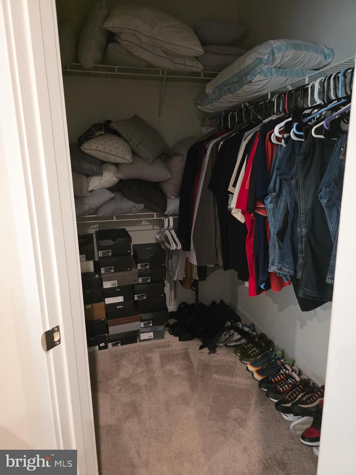 14510 Hunts Farm Road Brandywine, MD 20613 - Photo 44 of 74 a view of walk in closet with clothes and shoes