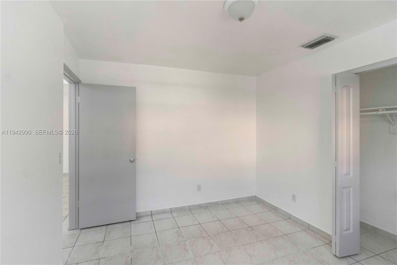 642 East 2nd Avenue, Unit A Hialeah, FL 33010 - Photo 10 of 14 a view of an empty room