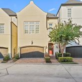 a front view of a house with yard