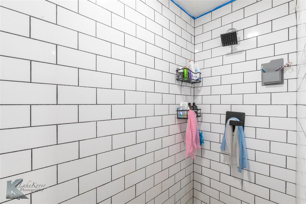1909 River Oaks Road Abilene, TX 79605 - Photo 22 of 40 a bathroom with a shower