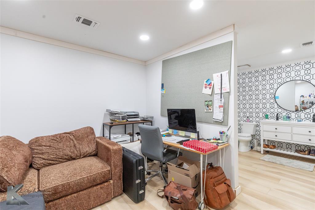 1909 River Oaks Road Abilene, TX 79605 - Photo 24 of 40 a living room with furniture and a flat screen tv