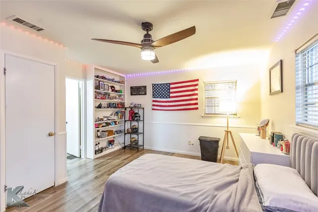 a bedroom with a bed and a table in it