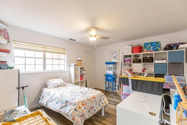 a view of a backyard with a tub and trees in the background
