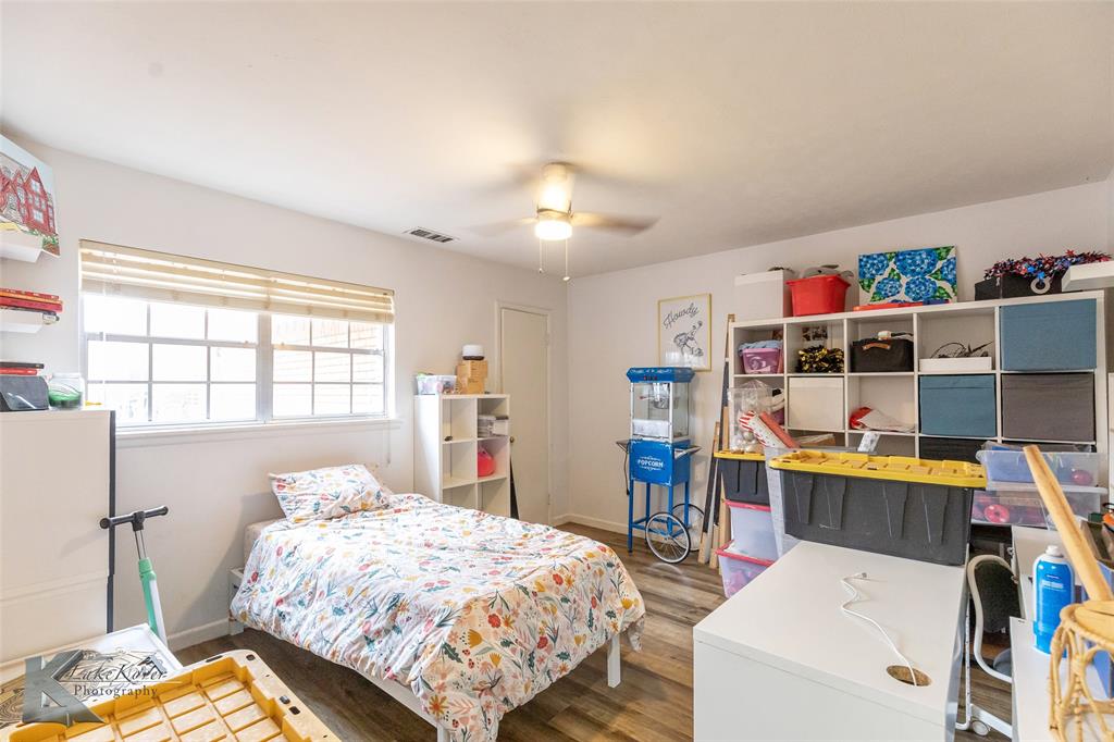 1909 River Oaks Road Abilene, TX 79605 - Photo 32 of 40 a bedroom with a bed and a window