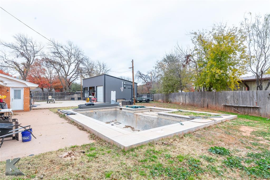1909 River Oaks Road Abilene, TX 79605 - Photo 34 of 40 a view of a house with swimming pool and sitting area