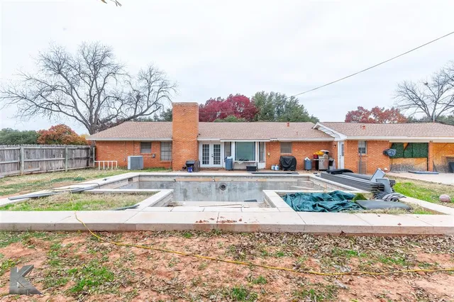 a view of a house with a snow on the road