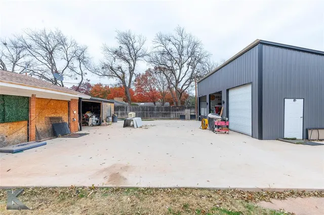 a view of a house with a snow in the patio
