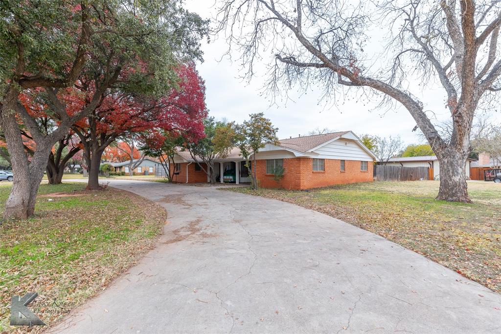 1909 River Oaks Road Abilene, TX 79605 - Photo 5 of 40 a view of house with outdoor space and trees
