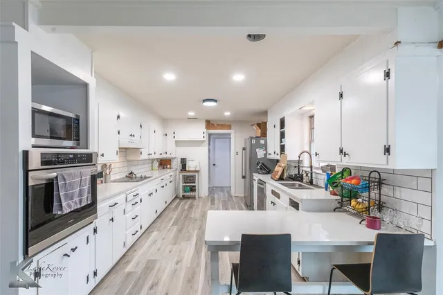 a large kitchen with cabinets
